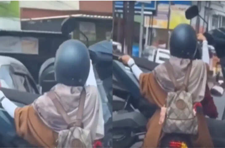 नया इलेक्ट्रिक स्कूटर खरीदा, चलाना नहीं आया तो महिला ने गोद में रखकर कराया सफर