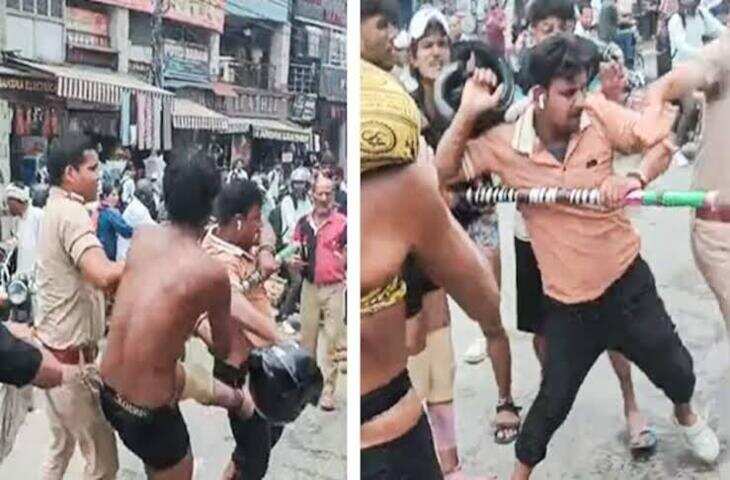 कौशांबी में दबंगों का आतंक! बाइक सवार युवक को बीच सड़क रोका, मारपीट का VIDEO वायरल