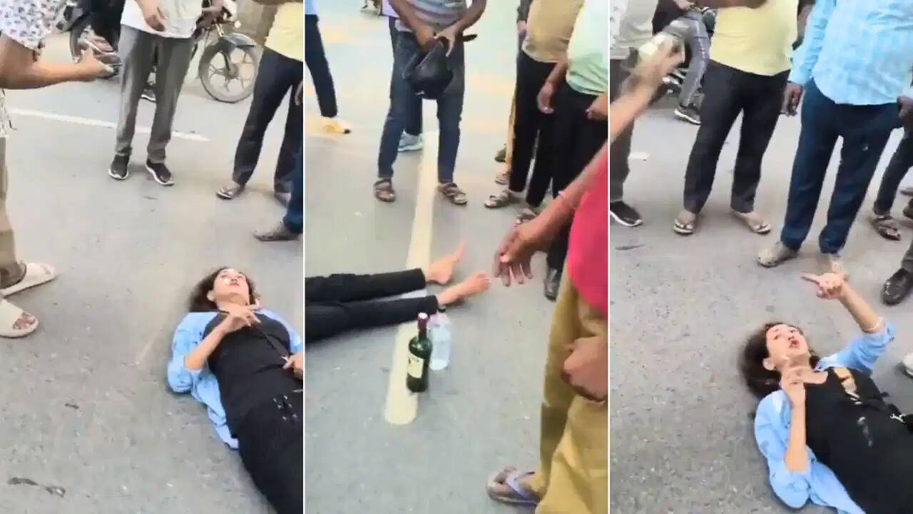 ग्रेटर नोएडा की सड़क पर महिला का हाई वोल्टेज ड्रामा, हाथ में सिगरेट और बगल में बोतल; VIDEO हुआ वायरल
