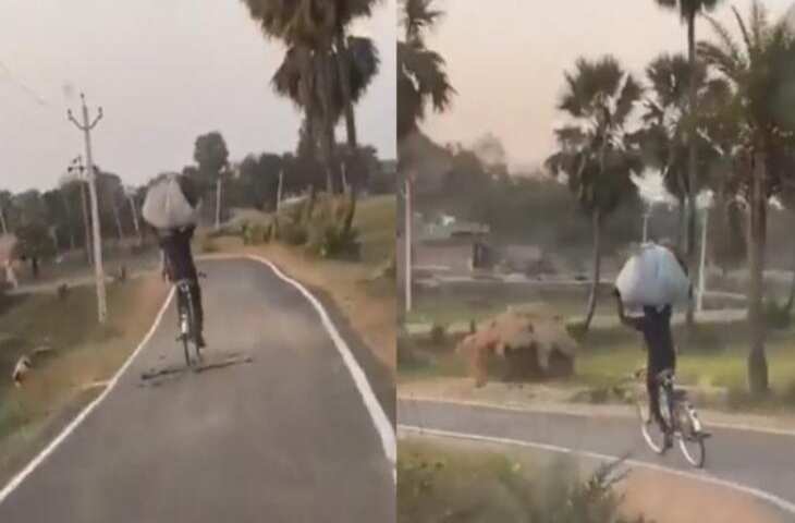 लड़के ने सिर पर घास की गठरी रख हाथ छोड़कर चलाई साइकिल, वीडियो देखकर दंग रह गए लोग