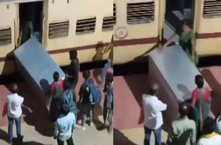 रेलवे स्टेशन पर भारी बक्सा चढ़ाने की जद्दोजहद, महिला ने सिर पर उठाकर चौंकाया