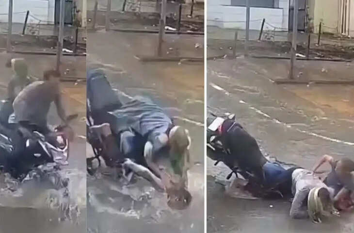 सैर का मजा बना सजा! सड़क के गड्ढे में गिरा कपल, वायरल VIDEO पर यूजर्स ने उठाए सिस्टम पर सवाल