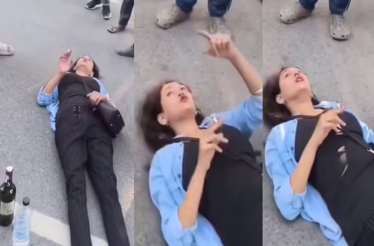 Viral Video: बीच सड़क पर लेटी मिली लड़की, हाथ में सिगरेट और पास में शराब की बोतल देख लोग रह गए हैरान