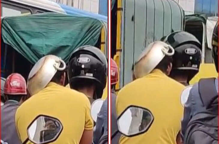 ट्रैफिक चालान से बचने के लिए युवक ने सिर पर कढ़ाही रखकर चलाई बाइक, बेंगलुरु का पुराना वीडियो फिर चर्चा में