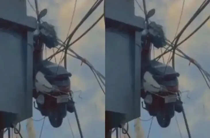 ऊंची बिल्डिंग की बालकनी से बिजली के तारों पर लटकी स्कूटी, देखकर हैरान रह गए लोग