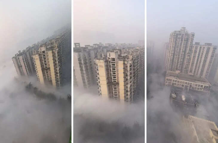 ग्रेटर नोएडा वेस्ट की गौर सिटी सोसाइटी में सोमवार सुबह एक शानदार नज़ारा देखने को मिला, जब पूरे इलाके में घने बादल और कोहरा छाया हुआ था। सोसाइटी में रहने वाले एक व्यक्ति ने अपने टावर की 23वीं मंज़िल से यह नज़ारा कैप्चर किया और यह अब सोशल मीडिया पर वायरल हो रहा है।  तस्वीर में बादलों के बीच ऊंची इमारतें दिख रही हैं, जैसे वे किसी पहाड़ी इलाके से आई हों। नीचे पेड़ और सड़कें बादलों से पूरी तरह छिप गई हैं। देखने वालों का कहना है कि यह नज़ारा हिमाचल या उत्तराखंड के पहाड़ों जैसा है, लेकिन यह नज़ारा ग्रेटर नोएडा वेस्ट का है।  सुबह-सुबह कुदरत का एक अलग ही रूप दिखता है  स्थानीय लोगों के मुताबिक, सुबह ठंडी हवा और ज़्यादा नमी की वजह से घना कोहरा और बादल ज़मीन के करीब आ गए थे। ऊंची इमारतों वाले अपार्टमेंट से देखने पर ऐसा लग रहा था जैसे इमारतें बादलों के समंदर से निकल रही हों।  सोशल मीडिया पर कई यूज़र्स ने वीडियो शेयर करते हुए लिखा, "अब पहाड़ देखने के लिए बाहर जाने की ज़रूरत नहीं है।" ग्रेटर नोएडा में ही स्विट्जरलैंड जैसा नज़ारा देखा जा सकता है। यह कुदरती खूबसूरती का एक अद्भुत नज़ारा है।  वायरल होते ही लोगों ने इसकी तारीफ़ की।  वीडियो वायरल होने के बाद लोगों ने इसे कुदरत का करिश्मा बताया। किसी ने इसे खूबसूरती कहा, तो किसी ने इसे बढ़ते प्रदूषण और क्लाइमेट चेंज से जोड़ा। एक्सपर्ट्स का कहना है कि सर्दियों के मौसम में नमी, ठंडी हवा और कम तापमान ऐसे नज़ारे बनाते हैं।  खूबसूरती के साथ सावधान रहने की ज़रूरत  नज़ारे तो कमाल के थे, लेकिन सुबह के समय कम विज़िबिलिटी की वजह से सड़कों पर गाड़ी चलाने वालों को मुश्किल हुई। प्रशासन ने लोगों से कोहरे के दौरान सावधानी से गाड़ी चलाने की अपील की है। ग्रेटर नोएडा जैसे मॉडर्न और डेवलप्ड शहर में यह कुदरती नज़ारा एक तोहफ़ा था। कुछ पलों के लिए ही सही, लेकिन इसने लोगों को रोज़मर्रा की भागदौड़ से निकालकर कुदरत के और करीब ज़रूर ला दिया।