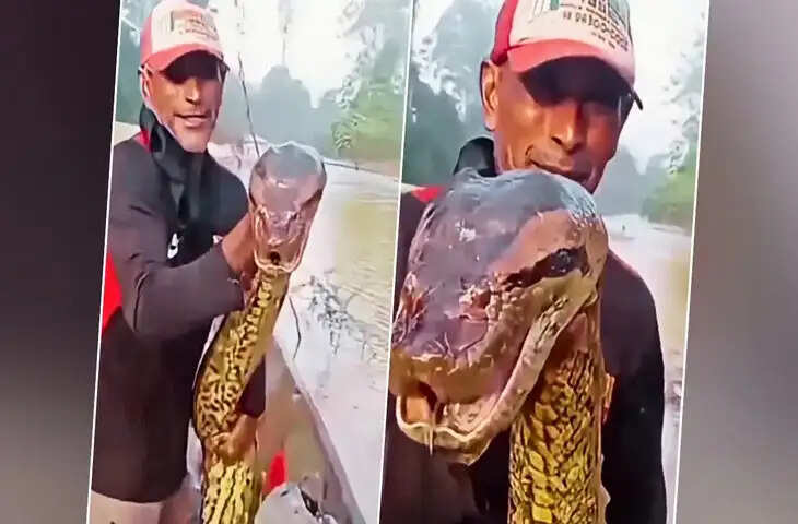 नदी के बीच नाव पर मछुआरे ने पकड़ा विशाल एनाकोंडा, लोगों में दहशत और हैरानी