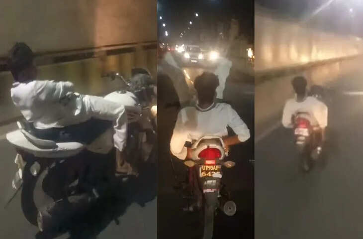 दोनों हाथ छोड़कर सीट पर लेटा युवक, पैर भी ऊपर किए, पीछे बैठे दोस्त बनाते रहे VIDEO; झांसी में बाइक पर खतरनाक स्टंट