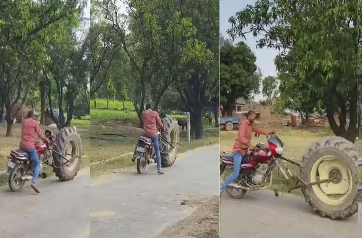 बाइक में लगा इतना बड़ा टायर कि लोग रह गए हैरान, सड़क पर चलते युवक का वीडियो वायरल