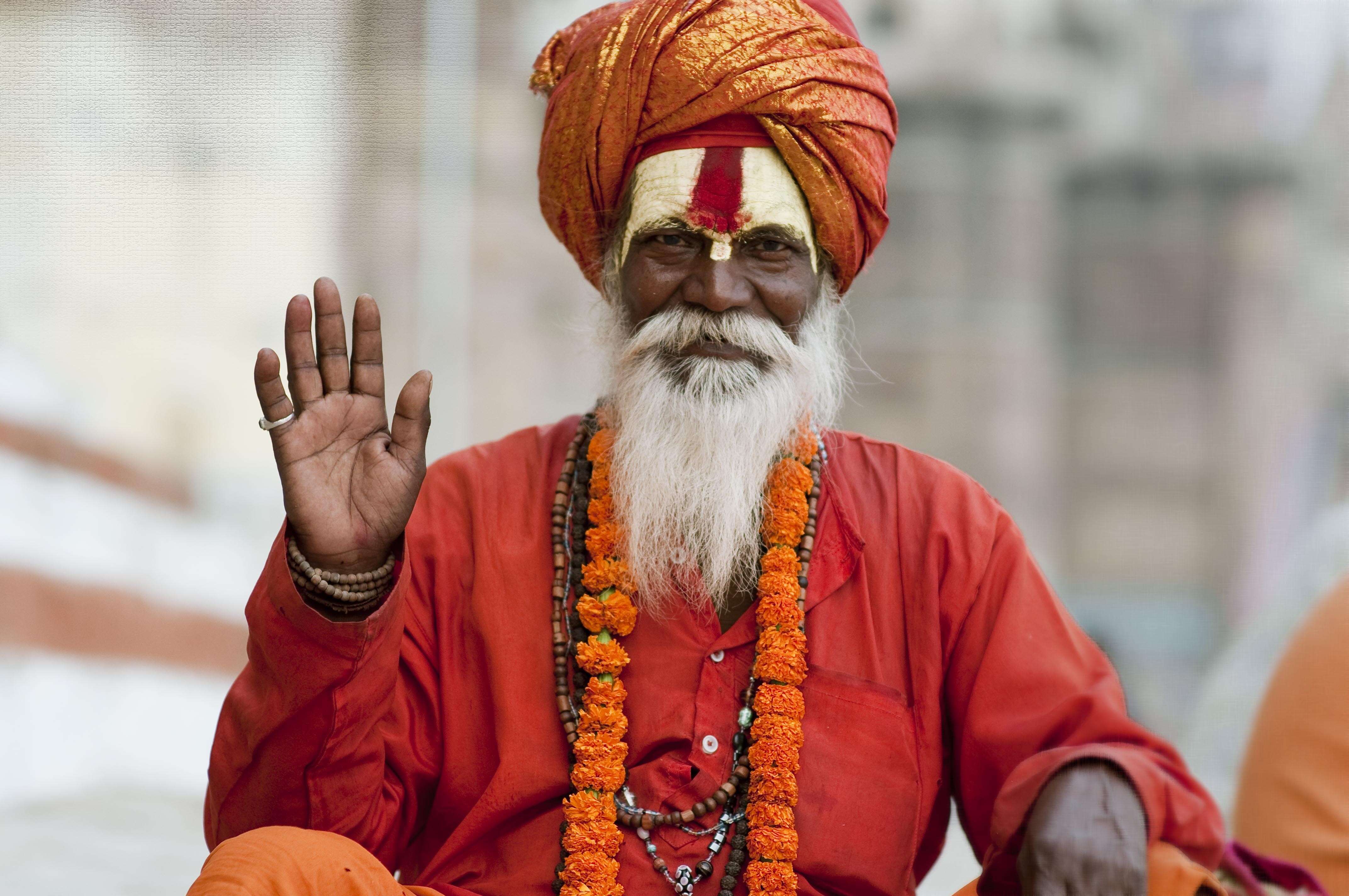 Why do sadhus and ascetics wear black saffron and white color clothes 